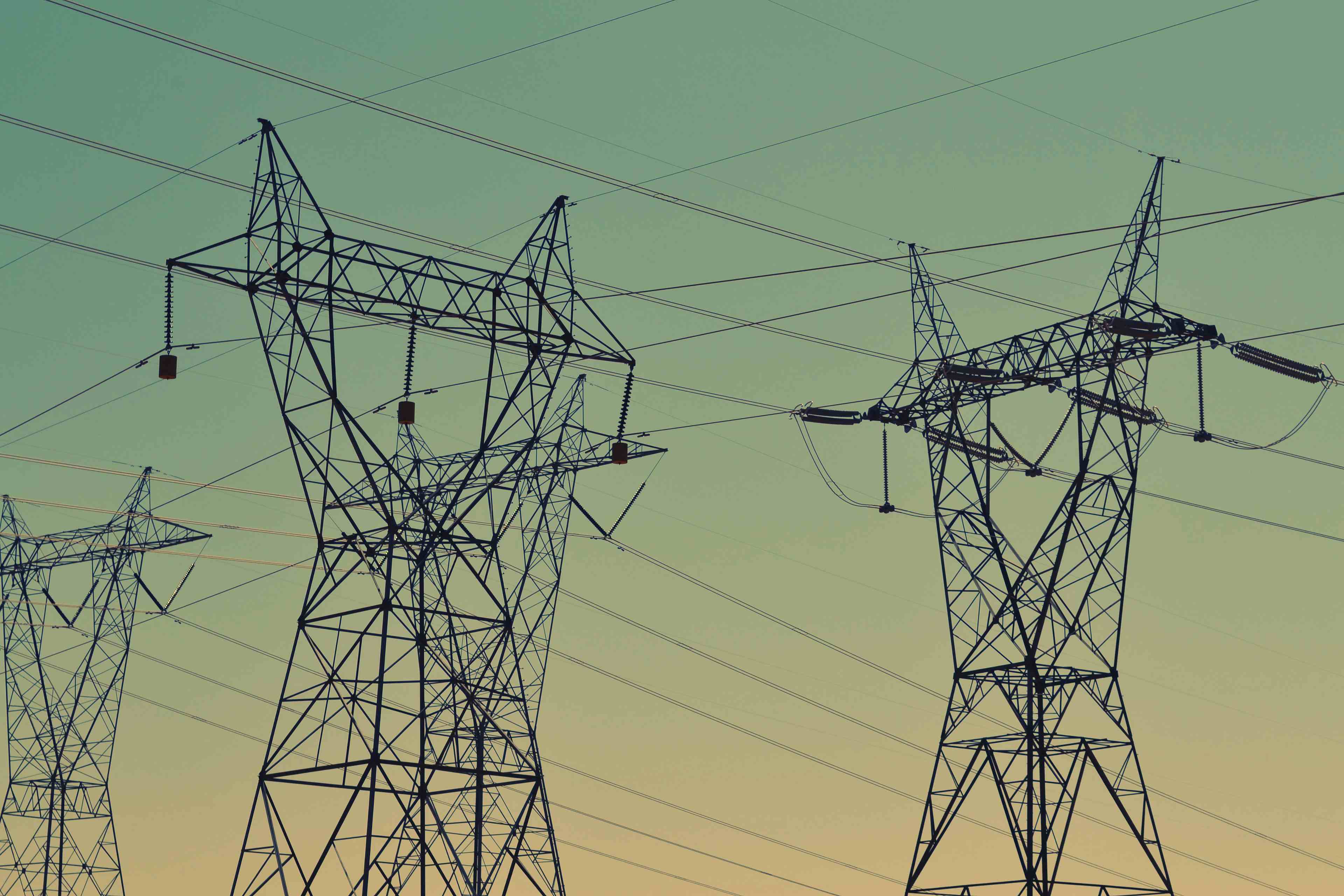 background image of overhead powerlines and towers